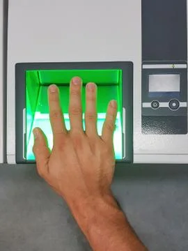 Top down view from a man using a fingerprint scanner for identification Stock Photos