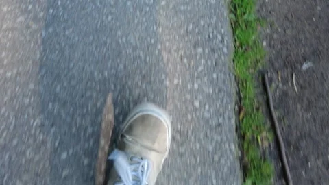Top Down View Of Man Walking Through The Park Shoes In Sunshine 002 Stock Footage 249772074