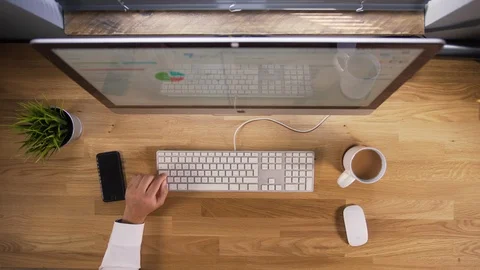 Top Down View of Man Working on Computer (4K) Stock Footage 90360702