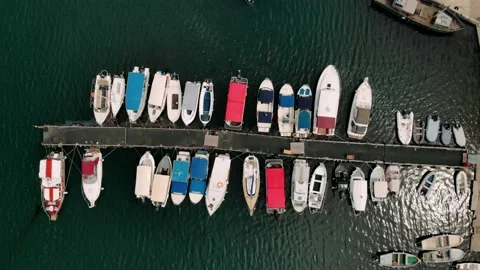 Top down view of marina harbor many colorful boats authentic ships fishing boat Stock Footage 163878677