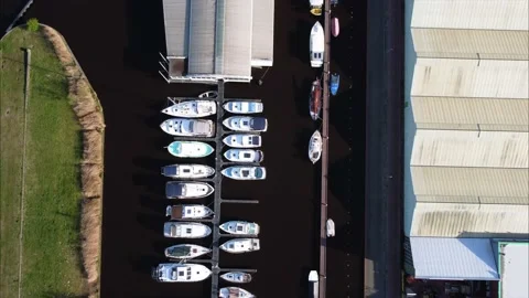Top down view of Marina harbor, slow forward flight over colourful docked boats Video stock 181235130