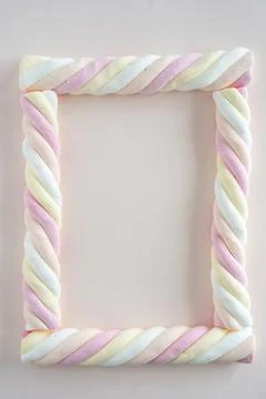 Top down view of marshmallow sweets (in Dutch: kabelspekjes), picture frame 写真素材