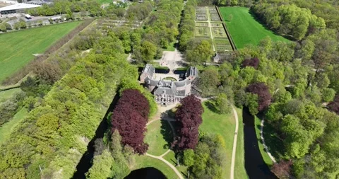 Top down view of the medieval castle, Kasteel Groeneveld, in a lush green Stock Footage 247322014