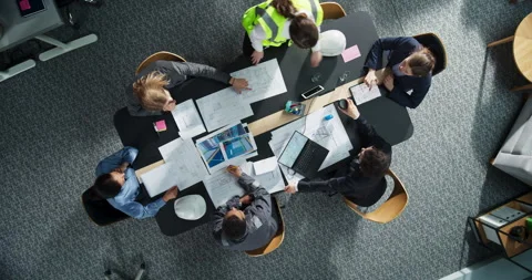 Top Down View Meeting of Team of Real Estate Construction Engineers Stockbeeldmateriaal 295202778