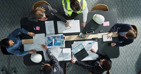 Top Down View Meeting of Team of Real Estate Construction Engineers Stockbeeldmateriaal 295203487