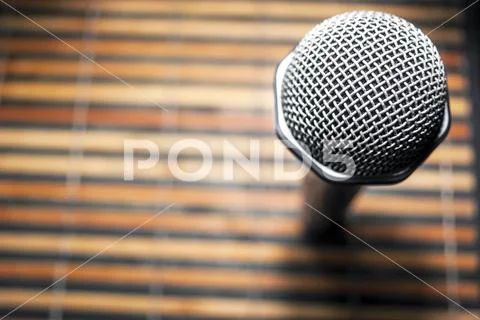 Top-Down View of A Microphone Head and Silver Grille Stock Photos