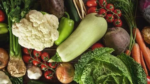 Top down view, mixed vegetable on wooden board desk Stock Photos