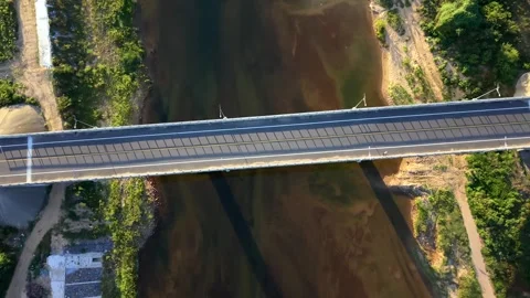 Top-down view of modern bridge over shallow river Stock Footage 336610355