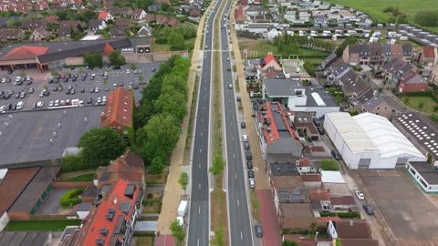 Top-Down View of Modern Natiënlaan Road with Traffic in Knokke | FlyLens 4K Stockbeeldmateriaal 309206570