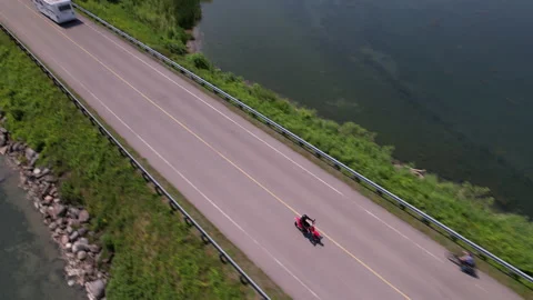 Top down view of a motorcycle driving on a beautiful highway in eastern onta Stock Footage 168772580
