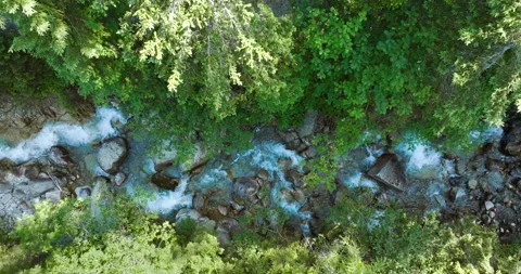 Top down view a mountain river flowing among large stones Stock Footage 231187625