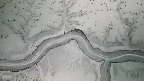 Top down view of mud flats with small river contour at Turnagain arm in Alask Stock Footage 322208844