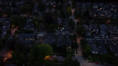 Top down view of North American houses with one under construction at dusk Stock Footage 197519390