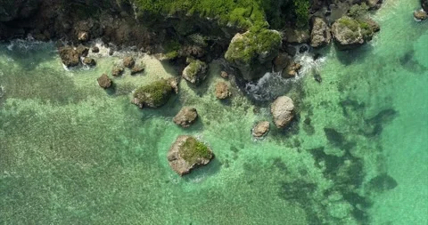 Top-down view of the ocean. Turquoise water in the coastal area. Stock Footage 153523781