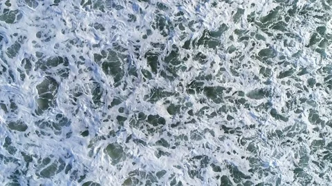 Top Down View of Ocean Wave Breaking in a Loop The Concept of Endless Motion Stock Footage 331984402