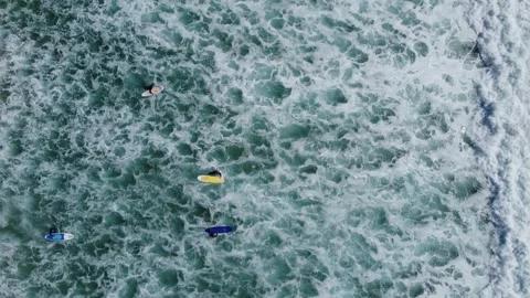 Top down view of ocean waves and surfers, fuerteventura, spain Video stock 286721443