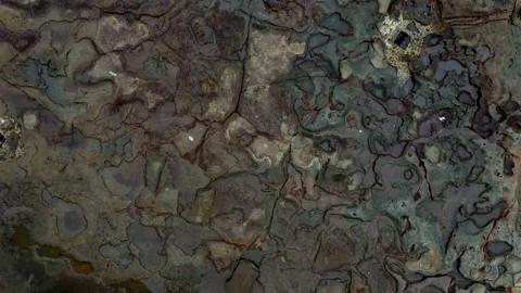 Top down view of by the ocean worn out rocks in the Pacific ocean Stock Footage 234955297