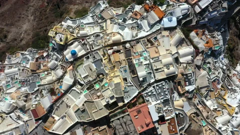 Top down view of Oia village on top of a cliff in Santorini Greece Stock Footage 219481053