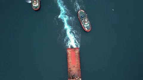 Top down view of the oil platforms towing convoy consisting multiple tug boats  Stock Footage 108452784
