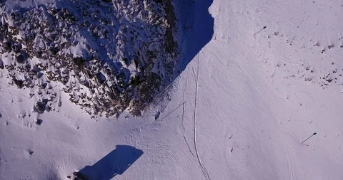 Top down view of old hut, cabin, early snow on rocky mountain Stock Footage 93500034