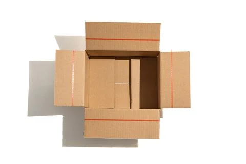Top-down view of an open cardboard box with visible flaps. Stock Photos