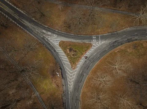 Top down view over an intersection, in a triangular shape, on a cloudy day in au Foto stock
