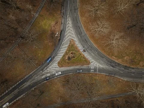 Top down view over an intersection, in a triangular shape, on a cloudy day in au Foto stock