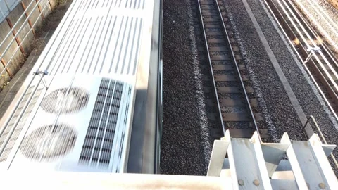 Top down view over to the japan track railway with train running moving pas.. Stock Footage 228853835