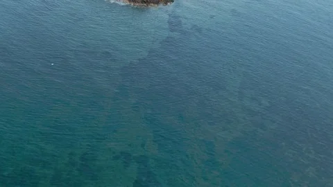 Top down view over small island with lighthouse Stock Footage 129633736