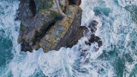 Top Down view over Waves and Cliffs from a drone, Cornwall, England Stock Footage 248055818