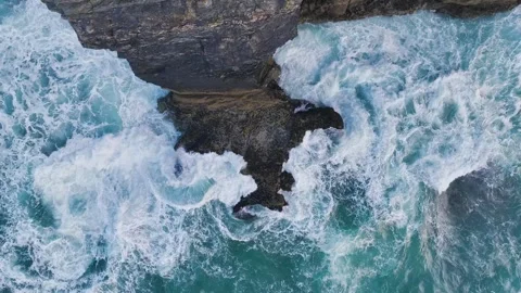 Top Down view over Waves and Cliffs from a drone, Cornwall, England Stock Footage 248055858