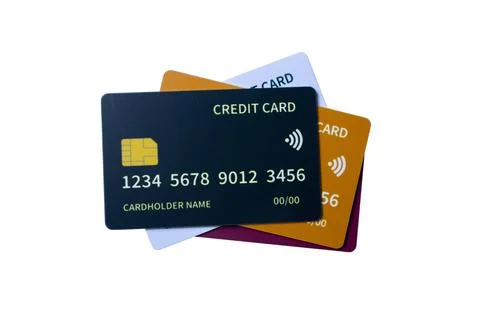 Top-down view of overlapping multi-colored credit and debit cards on a whit.. Stock Photos