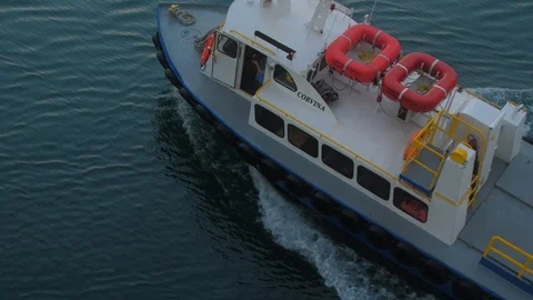 Top down view of Panama canal pilot boat pulling away from cruise ship Stock Footage 108637001