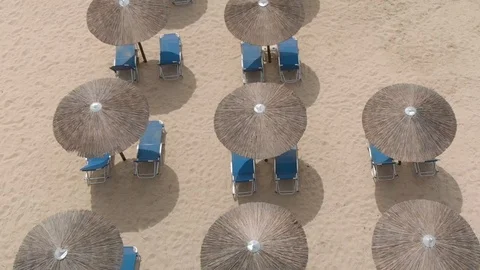 Top Down View Of Parasol and Beach Lounger On Sand. Stock Footage 99626414