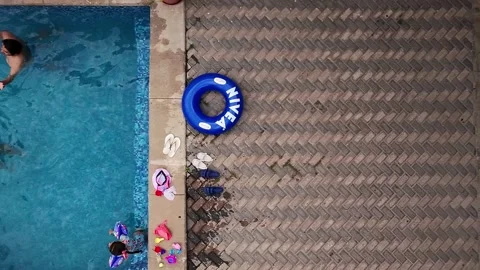 Top Down View of People at Alberca Plaza Pool Stock Footage 309512335