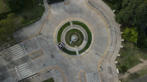 Top down view of people cycling in roundabout Stock Footage 153786391