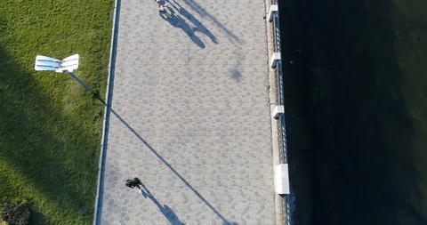 Top down view of people walking in spring park Stock Footage 127468150