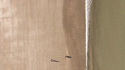 Top Down View Of People Walking At The Beach Along Stock Footage 295125156