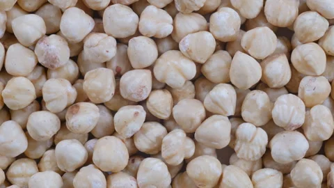 Top down view. A pile of shelled white hazelnut kernels. Slider shot. Stock Footage 296520564