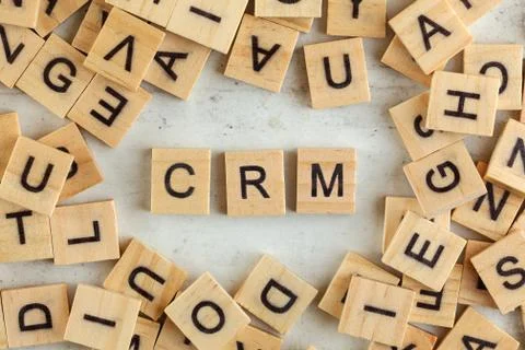 Top down view, pile of square wooden blocks with letters CRM stands for Custo Stock Photos