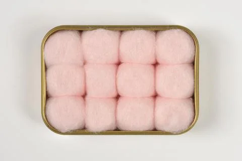Top-Down View of Pink Cotton Balls Packed Tightly inside a Plastic Box Stock Photos