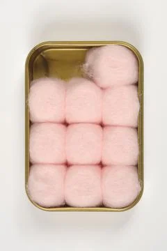 Top-Down View of Pink Cotton Balls inside a Open Rectangular Plastic Box Stock Photos