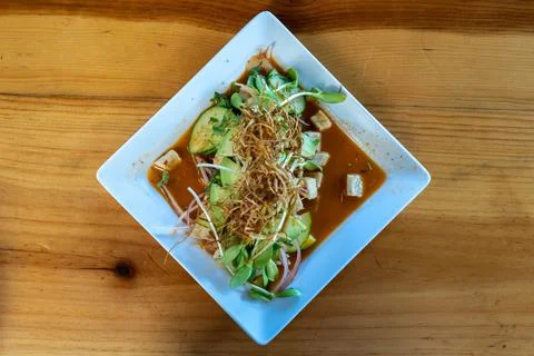 Top down view of a plate of fresh Mexican aguachile with fish, avocado, cucum 스톡 사진
