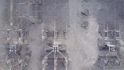 Top down view of power transformers and power lines at electric transformer Stock Footage 250193279