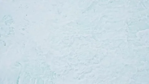 Top Down View of Powerful Ocean Waves Creating Foamy Patterns Stock Footage 296570397