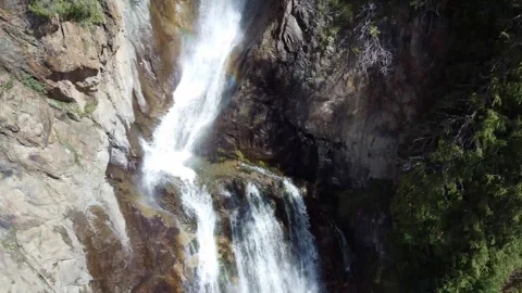 Top down view of powerful waterfall falling on wet rocks in mountain forest Stock Footage 335093461