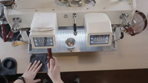 Top down view of a professional barista making a specialty coffee beverage with Stock Footage 328984072