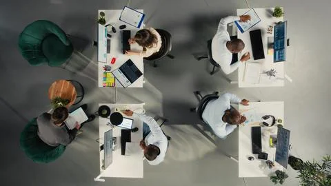 Top down view of professional diverse staff analyzing finance numbers Stock Photos