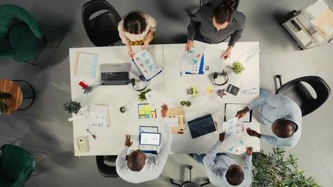 Top down view of professional staff analyzing finance numbers Stock Photos