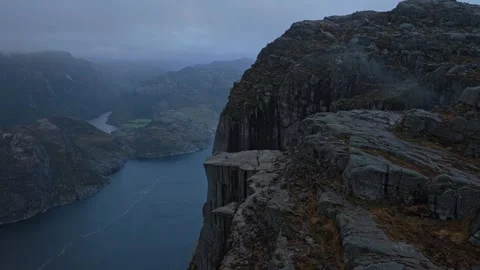 Top-down view of Pulpit Rock above Lysefjord waters in golden light Stock-Footage 320432210